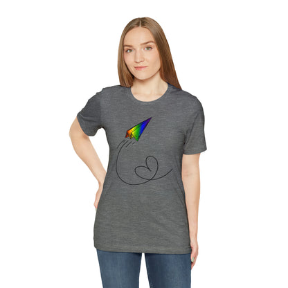 A vibrant t-shirt featuring a paper airplane design in the Pride rainbow colors. The rainbow colors symbolize LGBTQ+ pride and inclusivity.