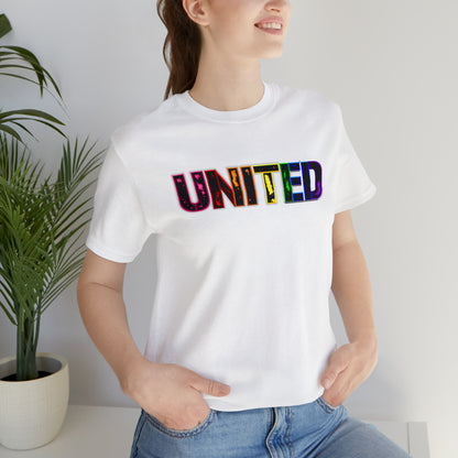 Image of a t-shirt with the word 'UNITED' printed on it in vibrant Pride rainbow colors, symbolizing unity, love, and inclusivity."