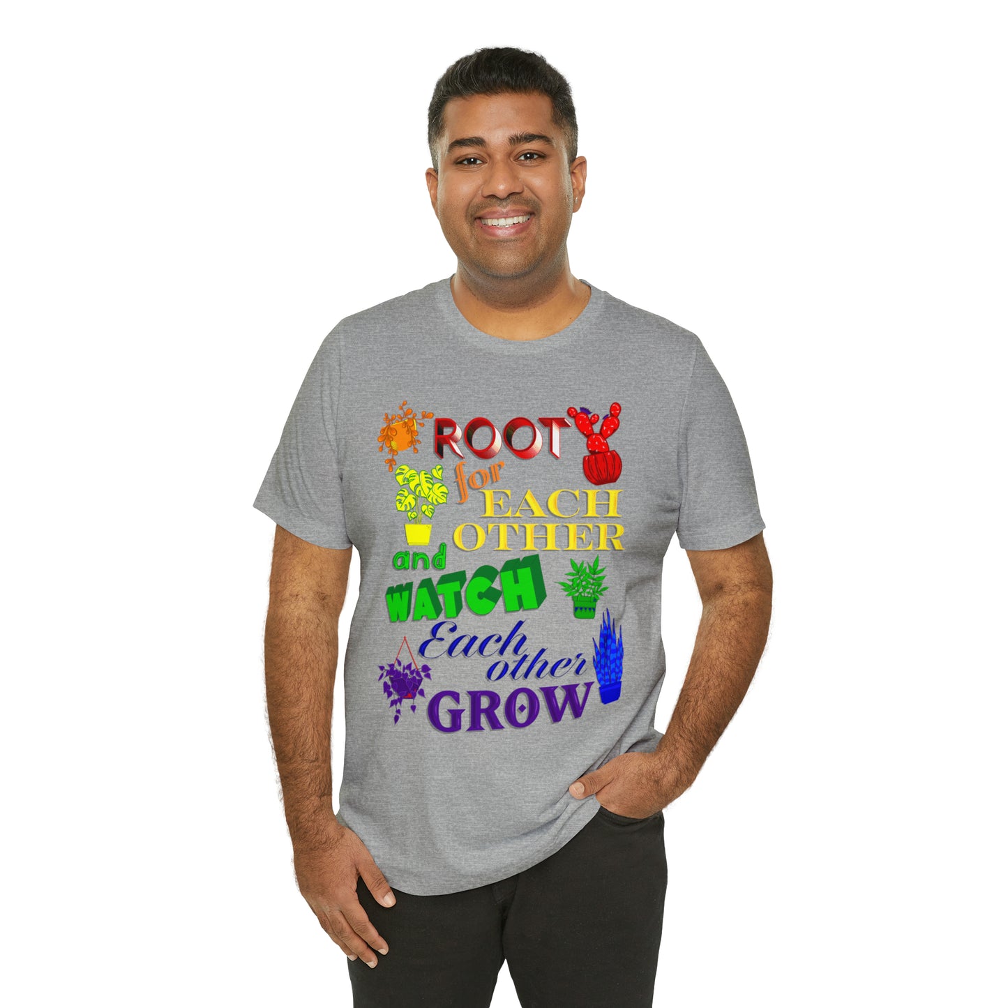 A vibrant t-shirt featuring a beautiful design of rainbow-colored plants. The phrase 'Root for each other and watch each other grow' is prominently displayed on the shirt. The design represents unity, support, and personal growth.