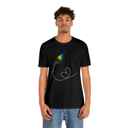 A vibrant t-shirt featuring a paper airplane design in the Pride rainbow colors. The rainbow colors symbolize LGBTQ+ pride and inclusivity.