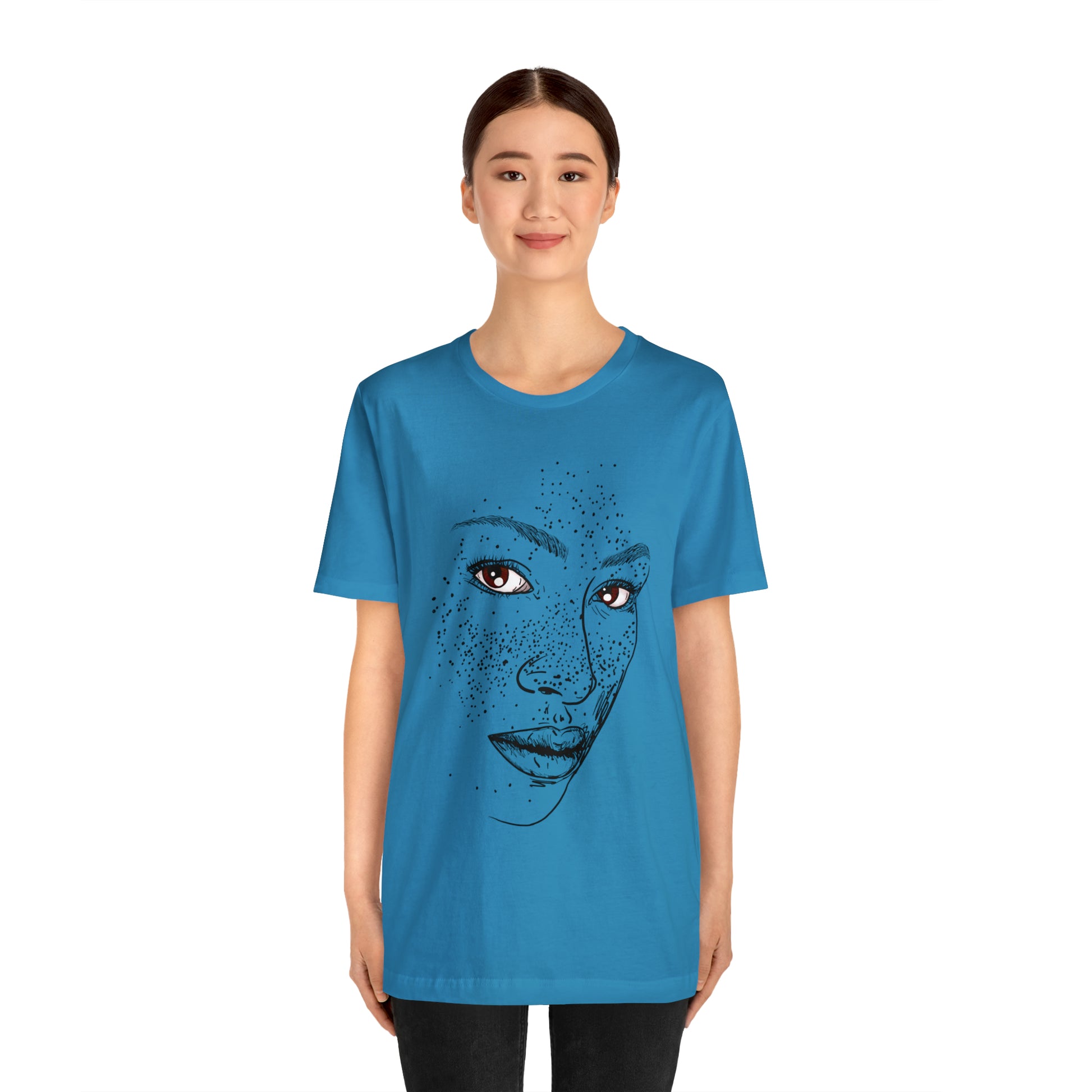 A person wearing a t-shirt with an illustration of a confident and empowered woman. The drawing depicts a woman with a sense of security, strength, and empowerment.