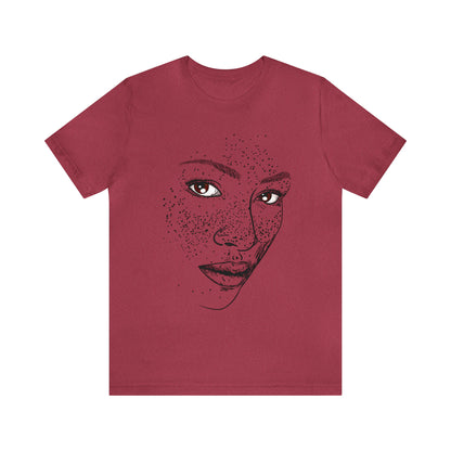 A person wearing a t-shirt with an illustration of a confident and empowered woman. The drawing depicts a woman with a sense of security, strength, and empowerment.