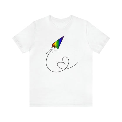 A vibrant t-shirt featuring a paper airplane design in the Pride rainbow colors. The rainbow colors symbolize LGBTQ+ pride and inclusivity.