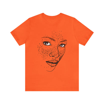 A person wearing a t-shirt with an illustration of a confident and empowered woman. The drawing depicts a woman with a sense of security, strength, and empowerment.