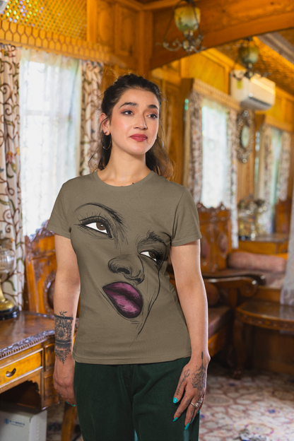 A woman proudly wearing a t-shirt featuring an inspiring image of another woman. The design showcases a confident and determined woman, symbolizing empowerment and ambition. This t-shirt serves as a visual representation of female strength and aspiration, encouraging others to dream big and reach for their goals.